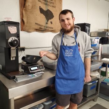 York Coffee Roastery - a man standing in front of a coffee roaster - Coffee Roasteries Near Me - York, South Carolina