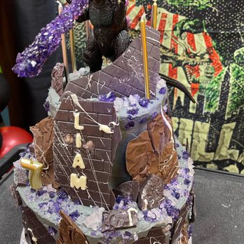 Canelas Sweets - "Godzilla" themed cake! Chocolate flavored with Oreo cream filling. - Custom Cakes Near Me