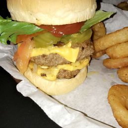 Double cheeseburgwr with fried onions, pickle, ketchup, lettuce and tomotao Double cheeseburgwr with fried onions, pickle, ketchup, lettuce and tomotao