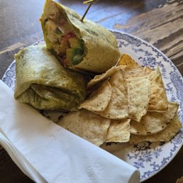 This breakfast burrito is tasty and the tortilla chips taste homemade. This breakfast burrito is tasty and the tortilla chips taste homemade.