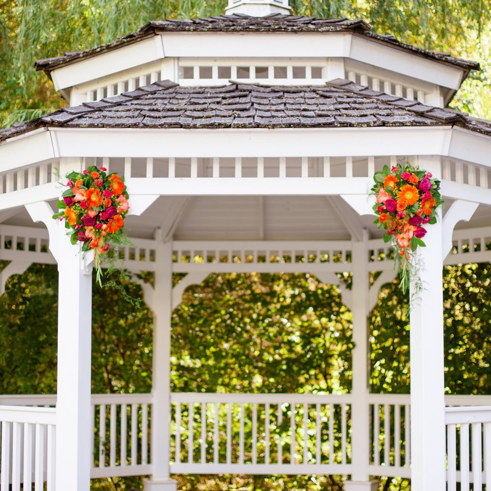 A Floral Affair - Teardrop-shaped arrangements for the gazebo. They were made so they could be transferred to the ends of the head table. - Florists Near Me - Oregon City, Oregon A Floral Affair - Teardrop-shaped arrangements for the gazebo. They were made so they could be transferred to the ends of the head table. - Florists Near Me - Oregon City, Oregon