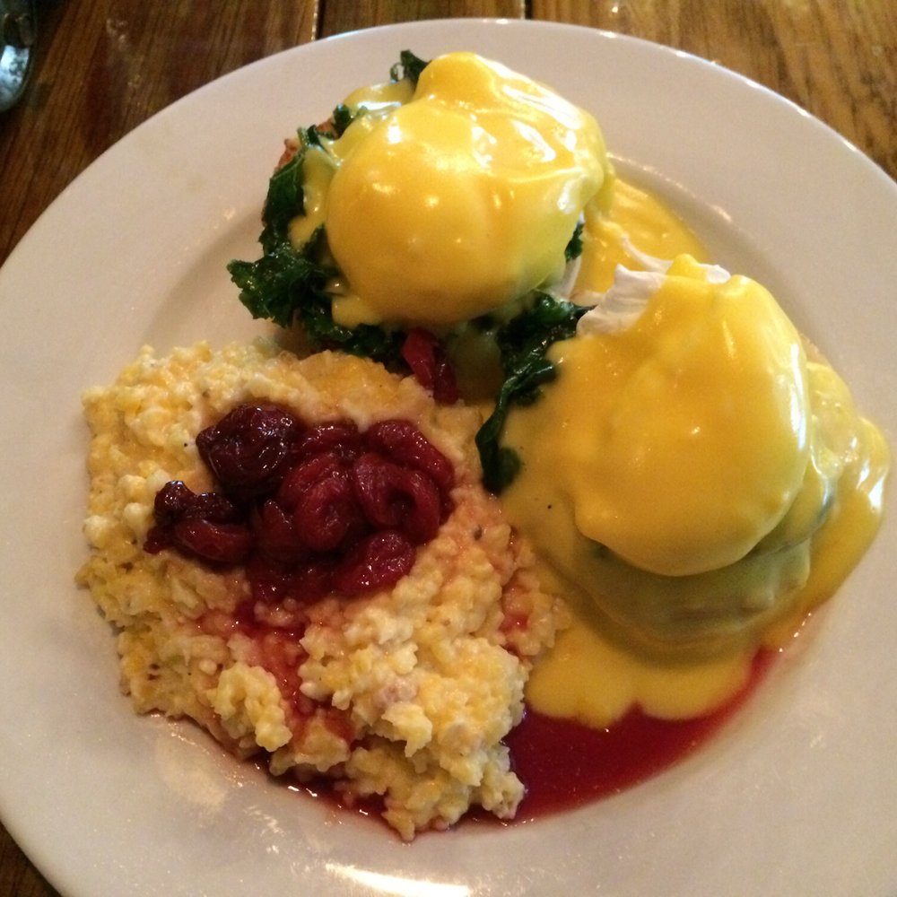 Backwater - Fried green tomato and spinach Eggs Benedict with cherry cheese grits. - Breakfast & Brunch Near Me - Melbourne, Florida Backwater - Fried green tomato and spinach Eggs Benedict with cherry cheese grits. - Breakfast & Brunch Near Me - Melbourne, Florida