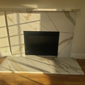 Cartage Flooring - Quartz Nile Calacatta on the Fireplace. - Countertop Installation Near Me - Fullerton, California Cartage Flooring - Quartz Nile Calacatta on the Fireplace. - Countertop Installation Near Me - Fullerton, California