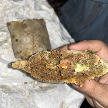 Taco Vazquez II - a hand holding a taco - Mexican Near Me - Fort Myers, Florida Taco Vazquez II - a hand holding a taco - Mexican Near Me - Fort Myers, Florida