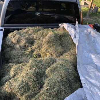 E’S Outdoor Services - a truck loaded with hay - Landscaping Near Me