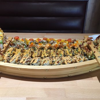 Sushi Taku - It you order enough rolls, it comes in a boat! - Japanese Near Me - Chicago, Illinois Sushi Taku - It you order enough rolls, it comes in a boat! - Japanese Near Me - Chicago, Illinois