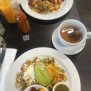 Bea Bea’s - Top Garden Omelette with house breakfast potatoes. With OJ. Bottom Volcano Omelette with fresh fruit cup. With chamomile hot-tea. - Coffee & Tea Near Me - Glendale, California Bea Bea’s - Top Garden Omelette with house breakfast potatoes. With OJ. Bottom Volcano Omelette with fresh fruit cup. With chamomile hot-tea. - Coffee & Tea Near Me - Glendale, California