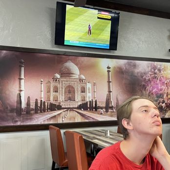 Twisted Indian Street Food - The inside of the restaurant is nicely decorated. Pay no attention to my son who is too cool to smile for a picture - Indian Near Me - Lemoore, California Twisted Indian Street Food - The inside of the restaurant is nicely decorated. Pay no attention to my son who is too cool to smile for a picture - Indian Near Me - Lemoore, California