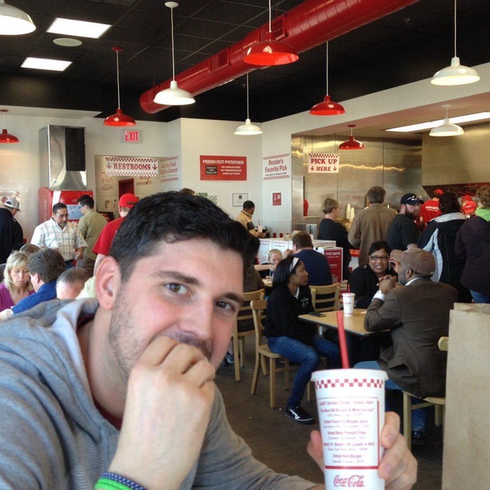 Five Guys - a man in a fast food restaurant - Hot Dogs Near Me - Muskegon, Michigan Five Guys - a man in a fast food restaurant - Hot Dogs Near Me - Muskegon, Michigan