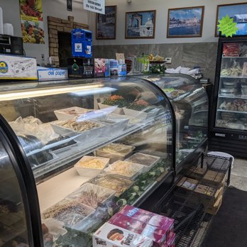 Al Kareem Bakery and Grill - a display case with a variety of foods - Bakeries Near Me - Dearborn Heights, Michigan