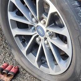 Flat tire bad lug nuts.