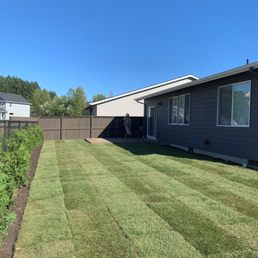 a back yard with a fenced in area