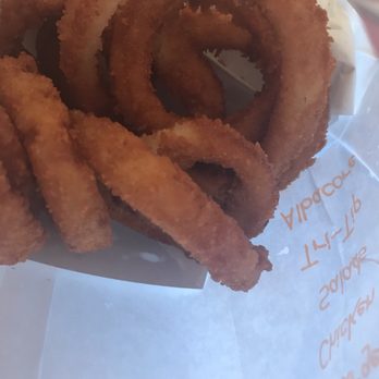 Habit Burger & Grill - Taking a peek Inside the bag of onion rings - Burgers Near Me - Montvale, New Jersey Habit Burger & Grill - Taking a peek Inside the bag of onion rings - Burgers Near Me - Montvale, New Jersey