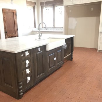 Monarch Contracting - Diamond cabinetry island with Farm sink. - Countertop Installation Near Me