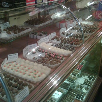 The Nutty Chocolatier - The Nutty Chocolatier - ONE of the display cases of hand made, hand dipped chocolates... sigh... - Chocolatiers & Shops Near Me - Huntsville, Ontario