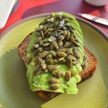 Hustle & Dough - Avocado toast (country sourdough, chili-lemon butter, fermented jalapeno, garlic pepitas) - Bakeries Near Me - Memphis, Tennessee Hustle & Dough - Avocado toast (country sourdough, chili-lemon butter, fermented jalapeno, garlic pepitas) - Bakeries Near Me - Memphis, Tennessee