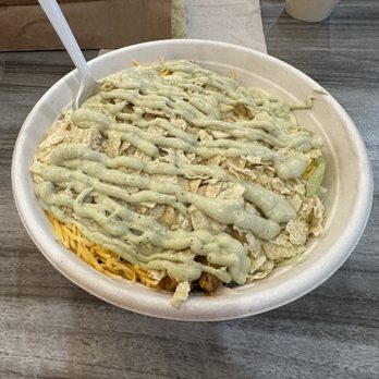 The Toasted Hog - Rice bowl with chicken, white rice, black beans, lettuce, cheddar cheese, crushed tortillas chips, queso, and avocado crema. - Tacos Near Me - Angola, New York
