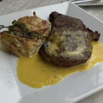 Cognac - Ribeye steak with a creamy potato gratin with béarnaise sauce. So good! Cooked perfect and the gratin was amazing. - French Near Me - St. Petersburg, Florida Cognac - Ribeye steak with a creamy potato gratin with béarnaise sauce. So good! Cooked perfect and the gratin was amazing. - French Near Me - St. Petersburg, Florida
