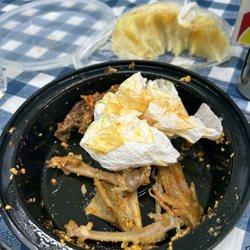 Modupe African & American Restaurant - A finished plate of mixed meats with egusi and pounded yam.