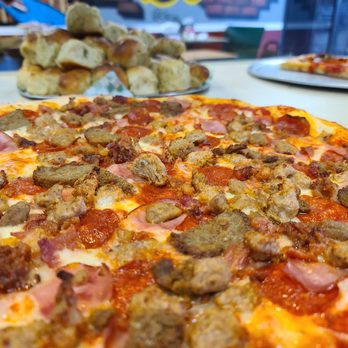 Sofia's Pizzeria - a pizza on a table - Pizza Near Me - San Antonio, Texas Sofia's Pizzeria - a pizza on a table - Pizza Near Me - San Antonio, Texas