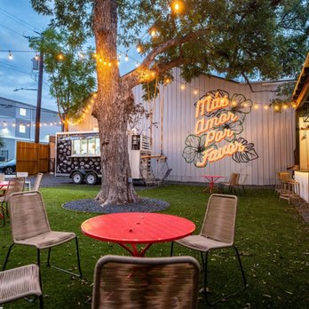 Ultimate Turf Solutions - a patio with tables and chairs - Landscaping Near Me - San Antonio, Texas Ultimate Turf Solutions - a patio with tables and chairs - Landscaping Near Me - San Antonio, Texas