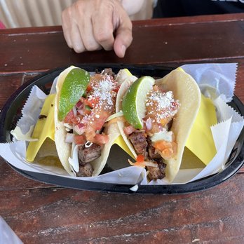 Peach Street Distillers - Pork Belly with Jalapeño Lime Aioli & Kimchi and carne asada taco - Distilleries Near Me - Palisade, Colorado