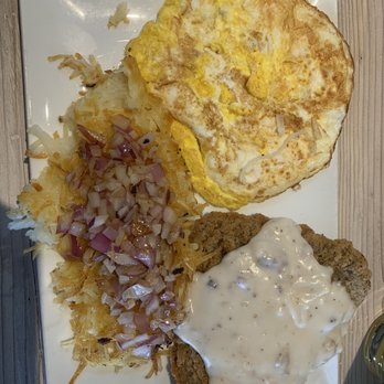 Country Waffles - Chicken fried steak with over hard eggs and hash browns with sautéed onions on top - Breakfast & Brunch Near Me - Morgan Hill, California
