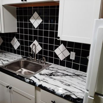 Advance Maintenance And Remodeling - a black and white kitchen - Handyman Near Me - Willseyville, New York Advance Maintenance And Remodeling - a black and white kitchen - Handyman Near Me - Willseyville, New York