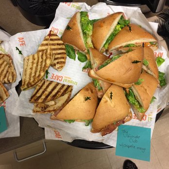 Tropical Smoothie Cafe - A catered tray with pesto chicken flatbread (almost gone!) and the ultimate club. - Sandwiches Near Me - Plano, Texas Tropical Smoothie Cafe - A catered tray with pesto chicken flatbread (almost gone!) and the ultimate club. - Sandwiches Near Me - Plano, Texas