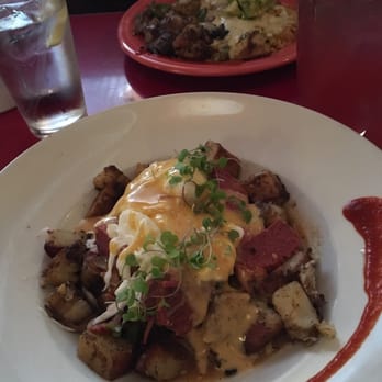 Millie's Diner - The corned beef hash and the Devils mess in the background. - New American Near Me - Richmond, Virginia Millie's Diner - The corned beef hash and the Devils mess in the background. - New American Near Me - Richmond, Virginia