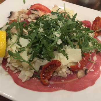 Gambino - Beef carpaccio with Arugula, shaved Parmesan and sundried tomatoes. - Italian Near Me - Paris, 75