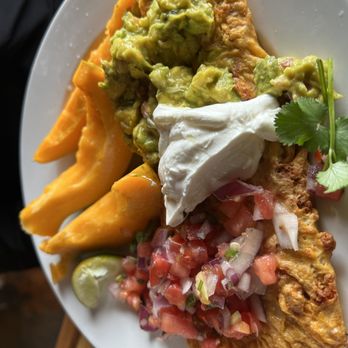 Olympic Cafe - a plate of food with chips and guacamole - Seafood Near Me - Kapaa, Hawaii Olympic Cafe - a plate of food with chips and guacamole - Seafood Near Me - Kapaa, Hawaii