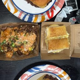 Humpty Dumpty egg sandwhich, sichuan hot chicken, three pack belly burger and loaded tots Humpty Dumpty egg sandwhich, sichuan hot chicken, three pack belly burger and loaded tots