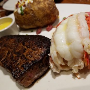 Outback Steakhouse - 9 ounce Victoria's filet mignon with a lobster tail and a loaded baked potato. - Steakhouses Near Me - Madison Heights, Michigan