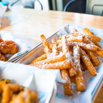 Wing Zone - a tray of powdered sugared doughnuts and a tray of fried chicken wings - Chicken Wings Near Me - N. Myrtle Beach, South Carolina Wing Zone - a tray of powdered sugared doughnuts and a tray of fried chicken wings - Chicken Wings Near Me - N. Myrtle Beach, South Carolina