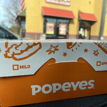 Popeyes Louisiana Kitchen - a donut box on the dashboard of a car - Fast Food Near Me - Vacaville, California Popeyes Louisiana Kitchen - a donut box on the dashboard of a car - Fast Food Near Me - Vacaville, California