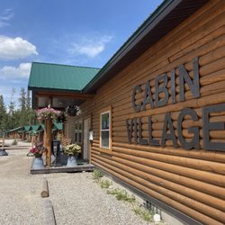 Cabin Village - The wall of the clubhouse with the name of the property.