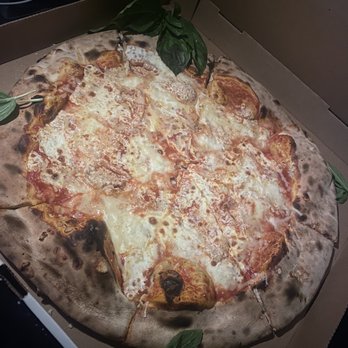 Lucali - "Large" pie with basil and garlic - Pizza Near Me - Brooklyn, New York Lucali - "Large" pie with basil and garlic - Pizza Near Me - Brooklyn, New York