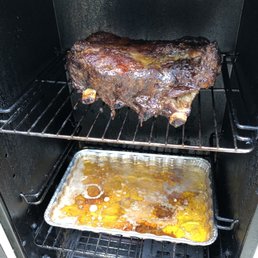 a rack of meat cooking in an oven