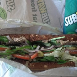 Subway Sandwich - Tuna sandwich with a drink.
