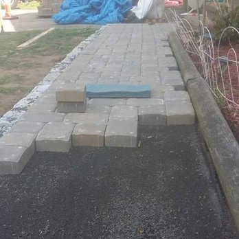 Sergio Landscaping - a brick walkway being laid in front of a house - Tree Services Near Me - New Milford, Connecticut Sergio Landscaping - a brick walkway being laid in front of a house - Tree Services Near Me - New Milford, Connecticut