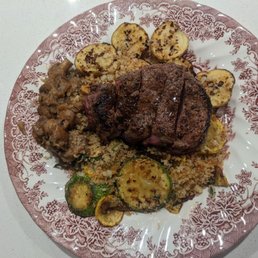 Filet mignon with roasted potatoes, mushroom in gravy, and panko crusted zucchini and squash