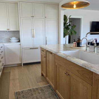 Nicolls Design Build - a kitchen with white cabinets and a marble countertop - General Contractors Near Me - Coronado, California Nicolls Design Build - a kitchen with white cabinets and a marble countertop - General Contractors Near Me - Coronado, California