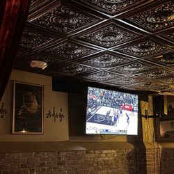 Dining area views with Knicks game playing