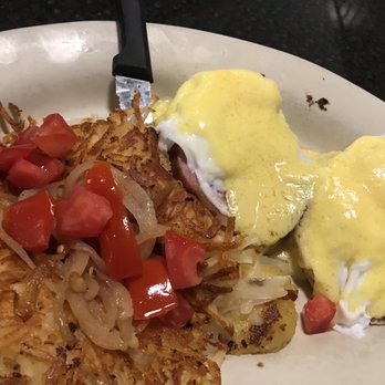 Toast - Eggs Benedict with hash browns topped with onions an tomatoes - Breakfast & Brunch Near Me - New Port Richey, Florida Toast - Eggs Benedict with hash browns topped with onions an tomatoes - Breakfast & Brunch Near Me - New Port Richey, Florida
