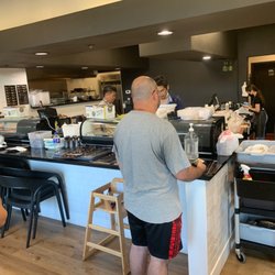 Mj Sushi - Order counter and kitchen with busy workers
