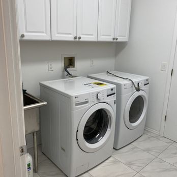 Good Life Renovation - a washer and dryer in a laundry room - General Contractors Near Me - Old Bridge, New Jersey Good Life Renovation - a washer and dryer in a laundry room - General Contractors Near Me - Old Bridge, New Jersey