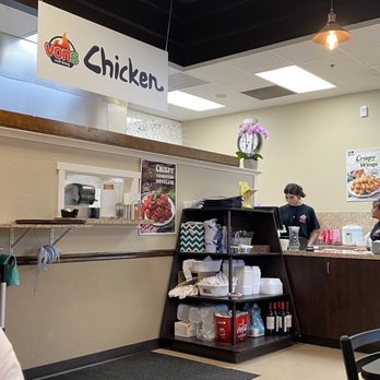 Vons Chicken - a woman sitting at the counter - Chicken Wings Near Me - Meridian, Idaho
