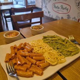 Pasta Trio (Rigatoni in pink sauce, spaghetti in Alfredo sauce, and penne in pesto sauce)