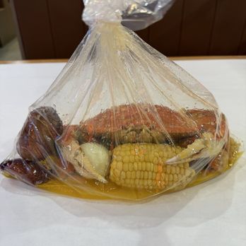 Jumpin’ Lobster - Dungeness crab ready to munch on egg and corn... - Cajun/Creole Near Me - Alhambra, California